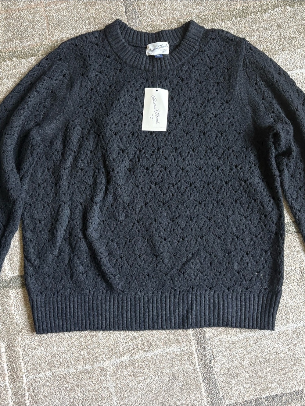 black pointelle knit crewneck long-sleeve sweater knit ribbed collar